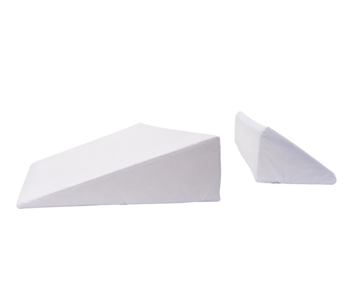 The BBL Add On Set includes two white wedge pillows—one large and flat, the other smaller and upright—perfectly designed to support your BBL recovery after a Brazilian Butt Lift.