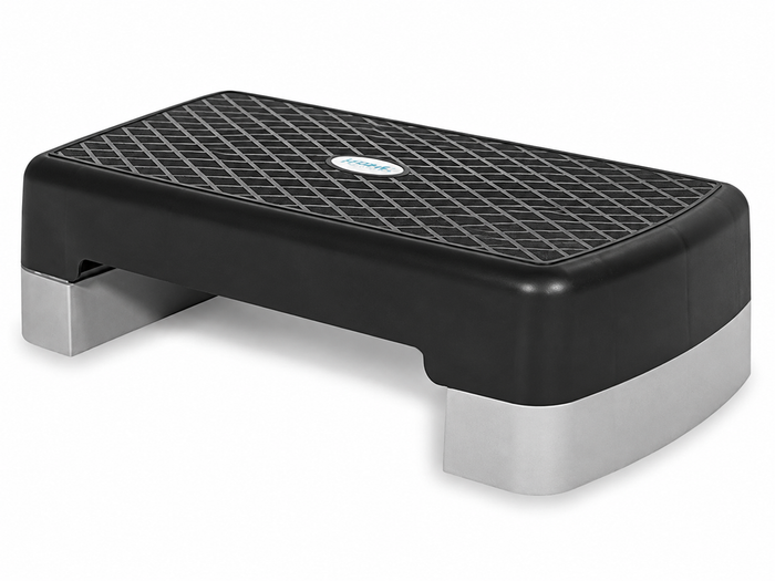 The Bedside Step Stool is a black and gray aerobic step platform featuring a textured, non-slip surface, perfect for fitness and exercise routines—and its versatile design allows it to double as a sturdy bedside step stool, offering enhanced safety and convenience.