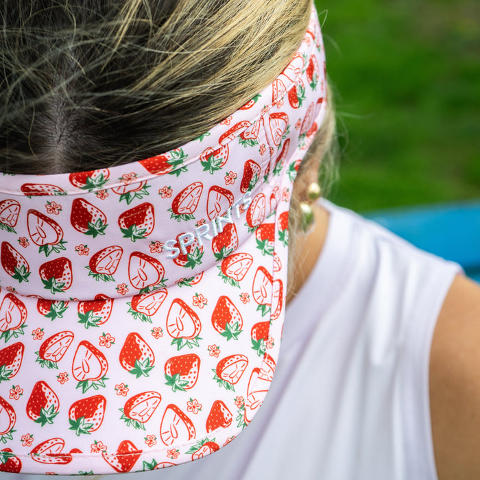 Close-up of the strawberry print pattern on the Berry Fast Strawberry Visor