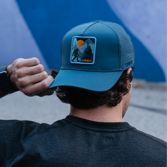 Runner wearing the Big Foot VP Hat