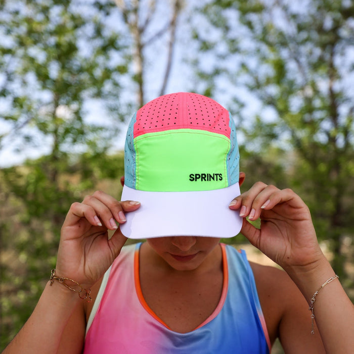 Runner wearing the Brisk Out The Blocks HyperG Hat, side view