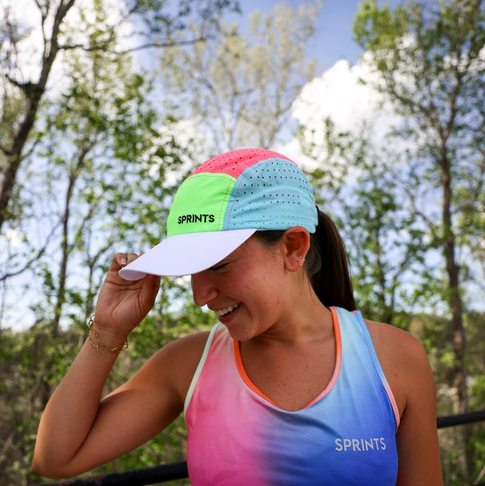Runner wearing the Brisk Out The Blocks HyperG Hat outdoors