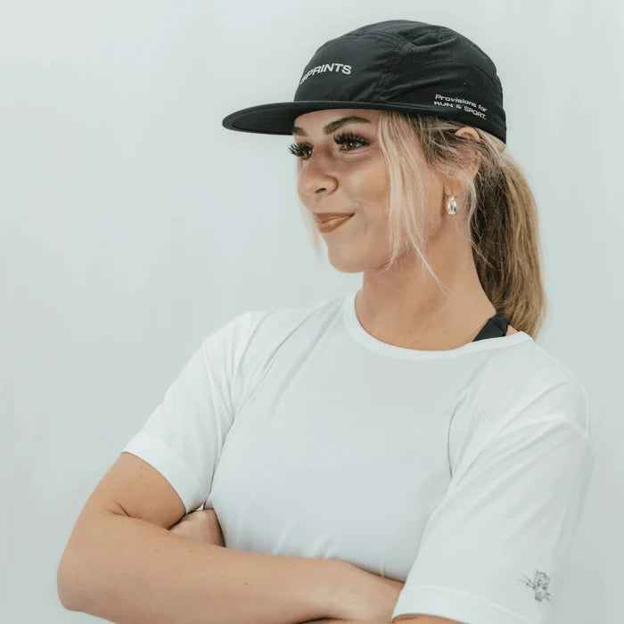 Runner wearing the Burnt Out Blaz5 flat brim hat