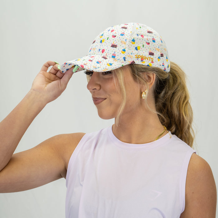 Runner wearing the Cake Day OG Hat