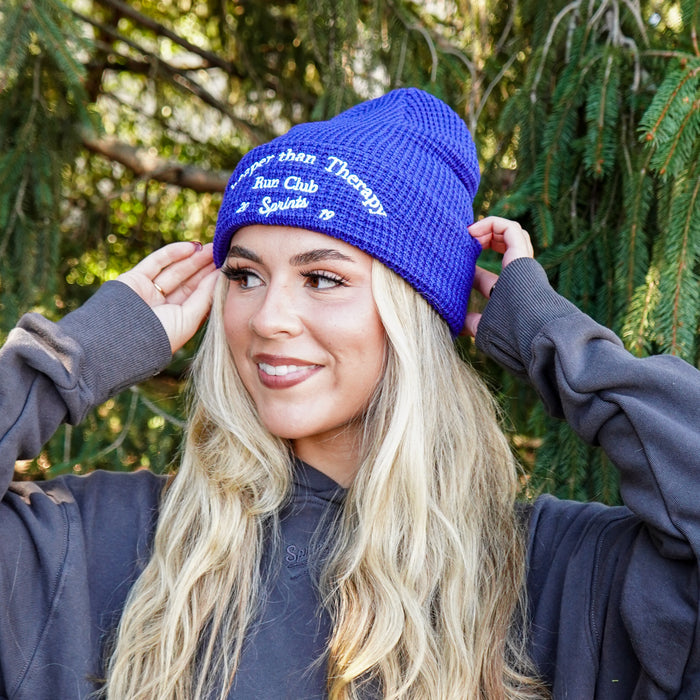 Person wearing the Cheaper Than Therapy Run Club Winter Hat