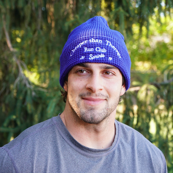 Person wearing the Cheaper Than Therapy Run Club Winter Hat, close-up