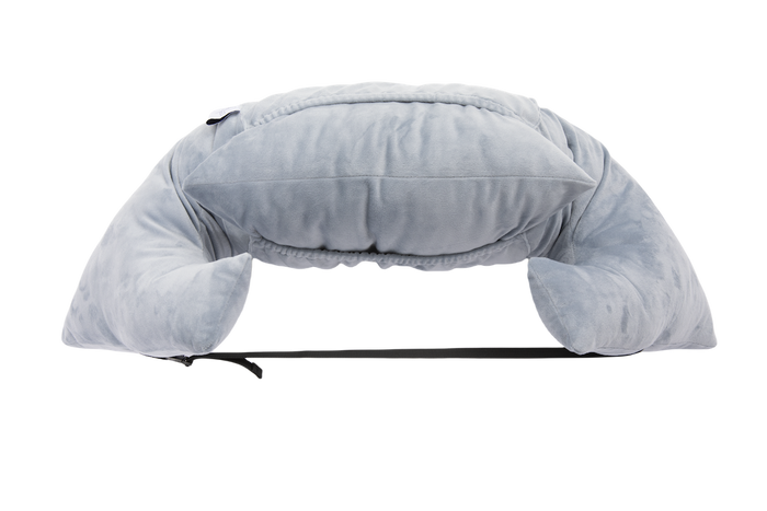 The Chest Pillow is a soft, light gray U-shaped travel pillow with extra top cushioning and a black adjustable strap, shown on a plain white background—perfect as a chest pillow for comfort after breast surgery.