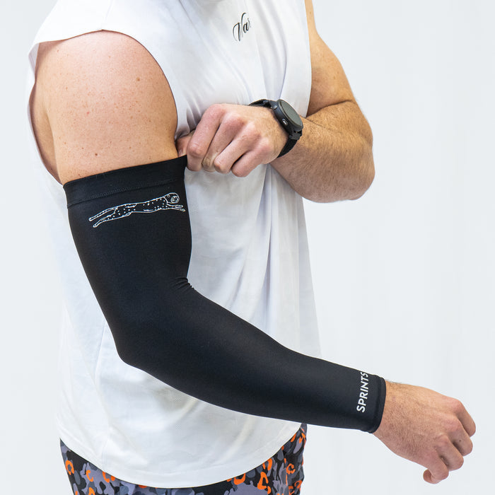 Person wearing the Compression Arm Sleeves in Black Flash Reflective