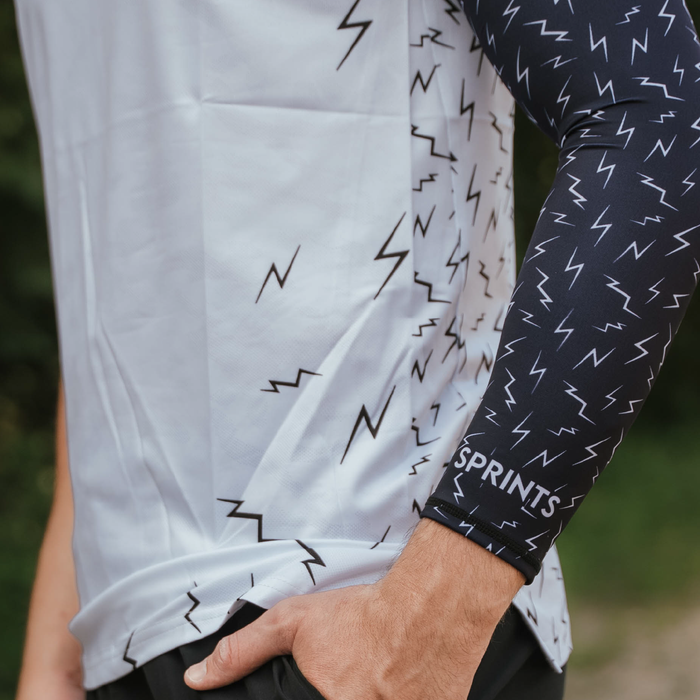 Runner wearing the Compression Arm Sleeves with lightning bolt print