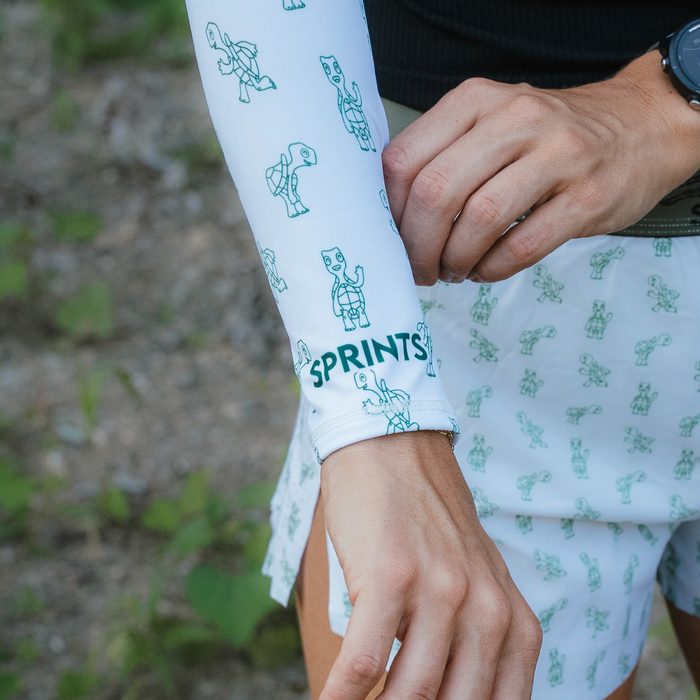 Runner wearing the Compression Arm Sleeves with turtle print