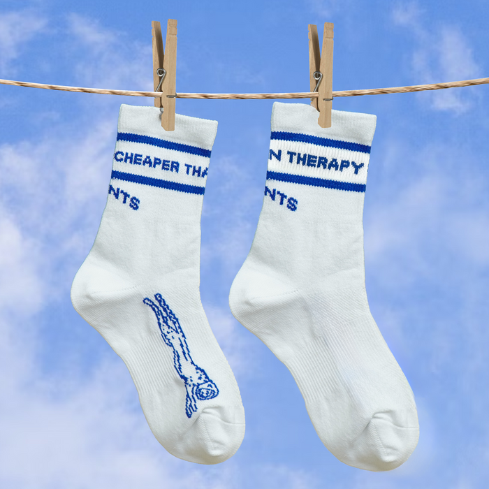Close-up of the Cheaper Than Therapy Run Club print on the Core Zero Socks