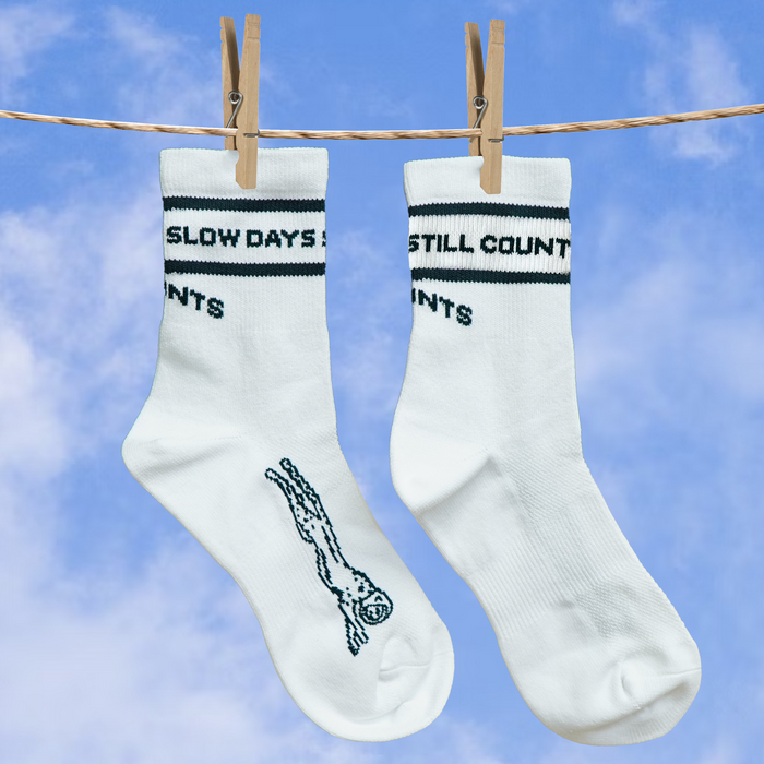 Close-up of the Slow Days Still Count print on the Core Zero Socks