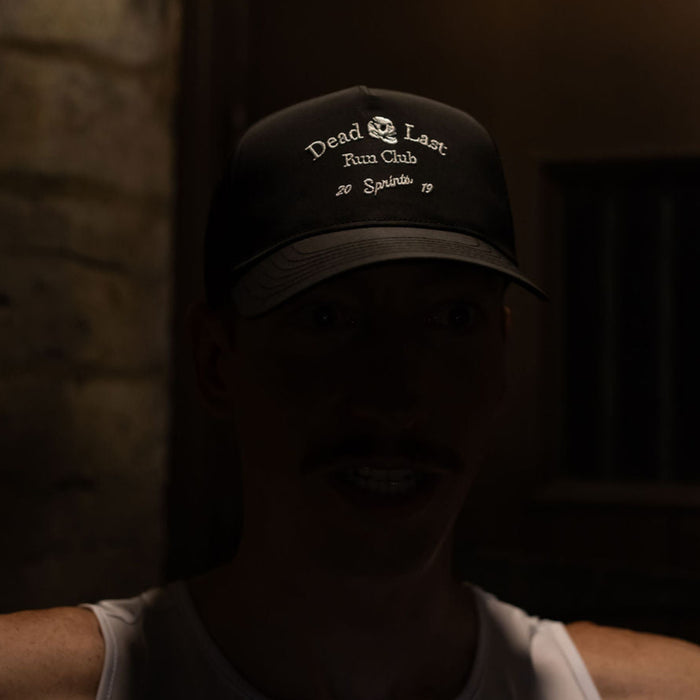 Person wearing the Dead Last Run Club Structured VP hat