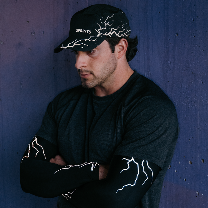 Runners wearing the Dystopian Dark Miles Reflective HyperG hat during a group run