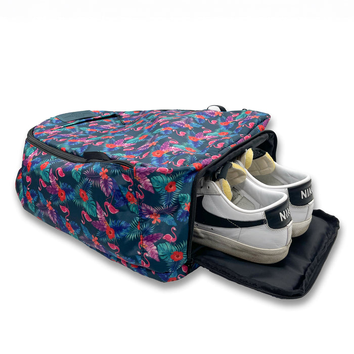 Flamingos Bolt Bag Backpack next to running shoes