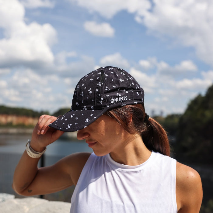 Woman wearing the Florid Declamation OG hat - side view