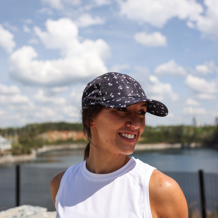 Woman wearing the Florid Declamation OG hat