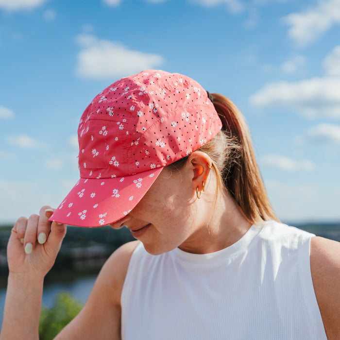 Runner wearing the Florid Declamation Pink HyperG Hat