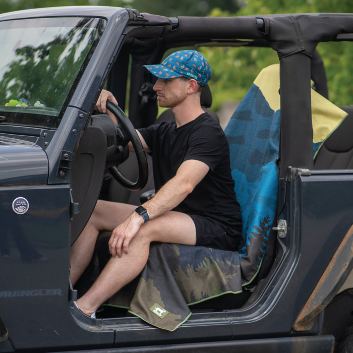 Grizzly Guide Car Seat Cover Towel installed on a car seat headrest