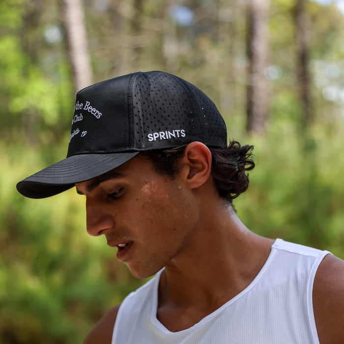 Runner wearing the Here for the Beers Run Club VP Hat, side view