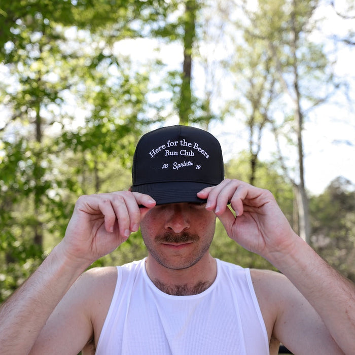Runner wearing the Here for the Beers Run Club VP Hat, front view