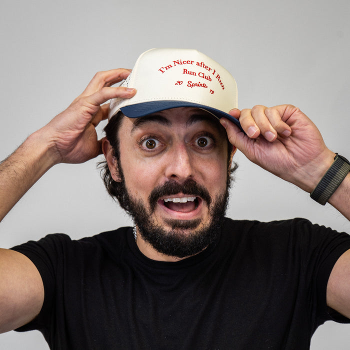 Runner wearing the I'm Nicer After I Run Club VP Hat outdoors