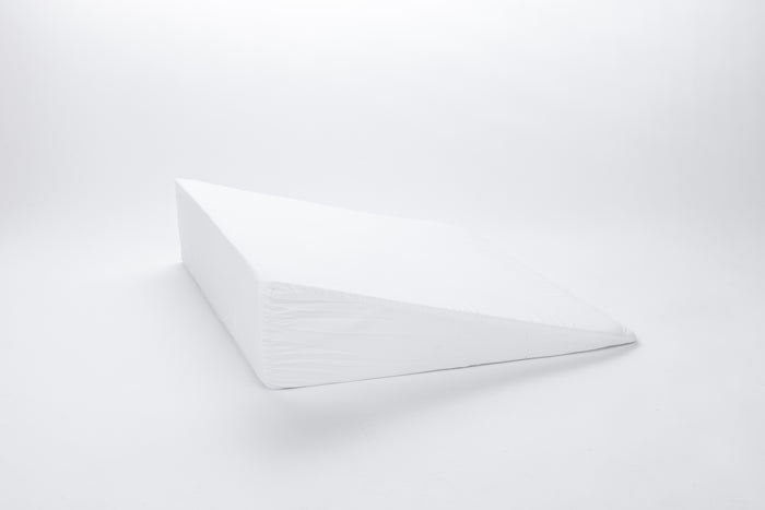The Individual Wedge Pillow Sold Separately, made of extra firm foam in white, is shown on a plain white background with its sloped side facing the viewer.