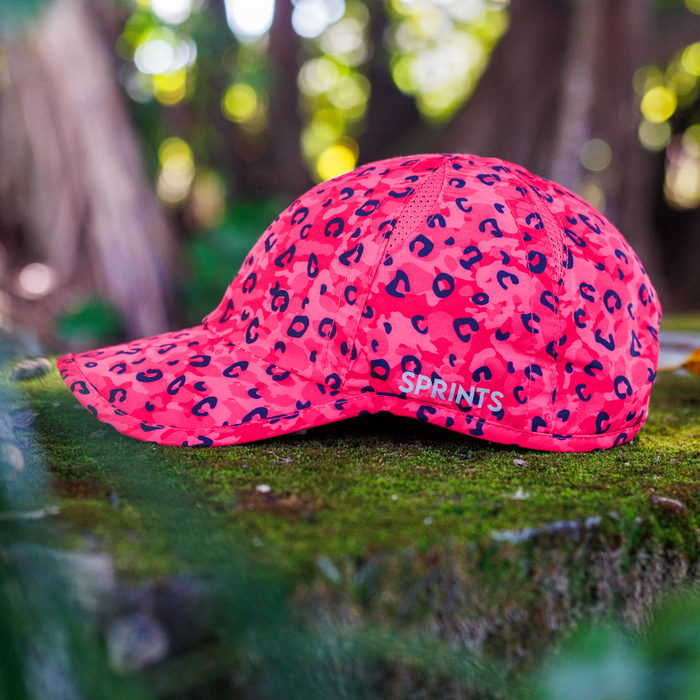 Runner wearing the Jag Camo Fuchsia OG hat