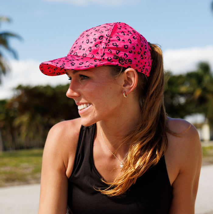 Person wearing the Jag Camo Fuchsia Ponytail Hat