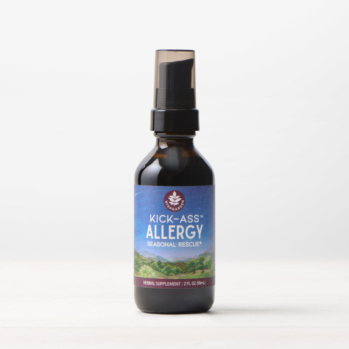 A 2 fl oz (59 ml) dark glass spray bottle of Kick-Ass Allergy, Seasonal Rescue stands on a light surface with a plain white background, offering natural allergy relief.
