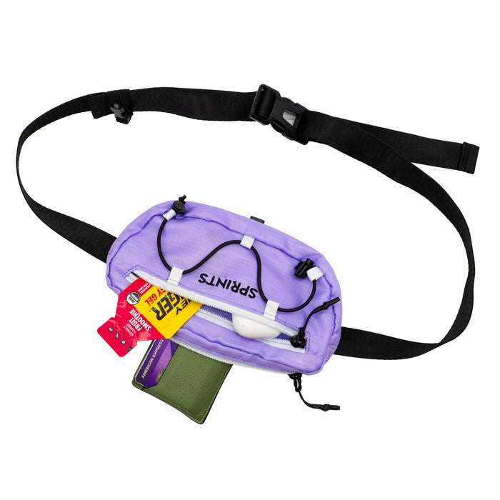 Person wearing the Lavender Crush Sling It Bag, outdoors