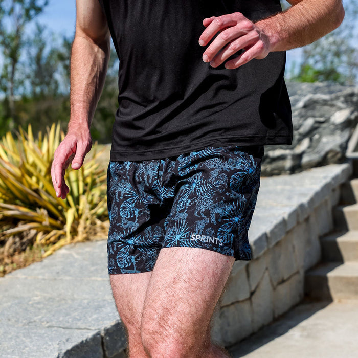 Man wearing the Mens Avigate 5 inch Fusion Short in Acid Jags Blue