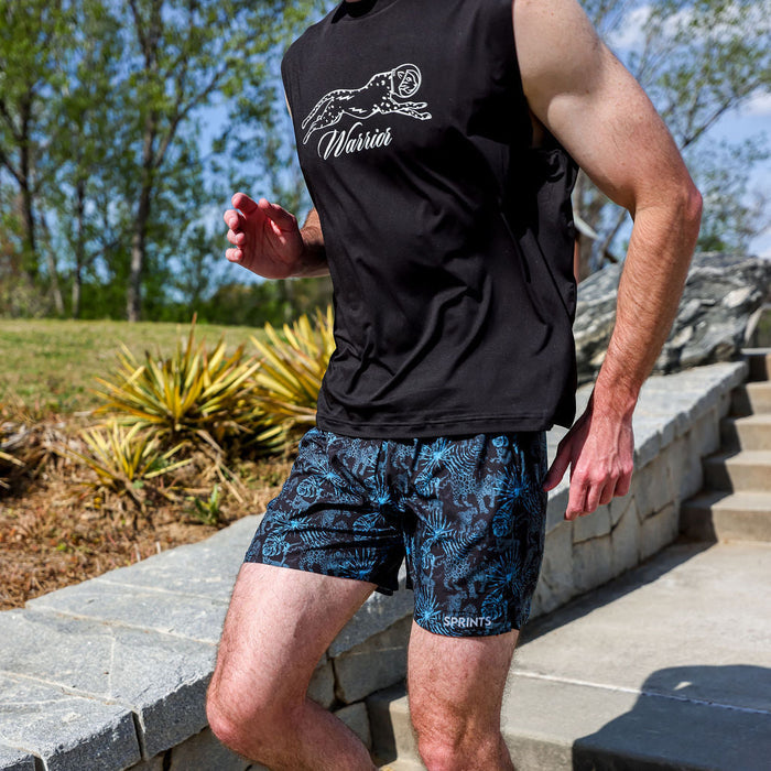 Runner wearing the Mens Avigate 5 inch Fusion Short in Acid Jags Blue