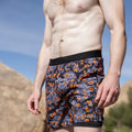 Man wearing the Avigate 5 inch Fusion Short in Jag Camo Blaze