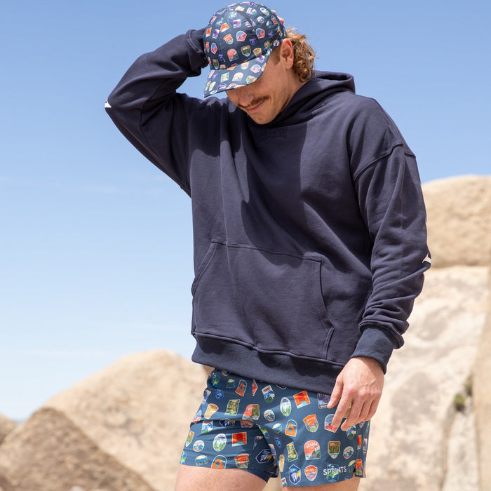 Man wearing the Avigate 5 inch Fusion Short in National Parks print, running