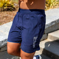 Man wearing the Avigate 5 inch Fusion Short in Stealth Navy