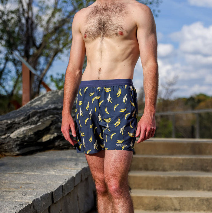 Man wearing the Avigate 5 inch Fusion Short in The Monkey Method print, side view