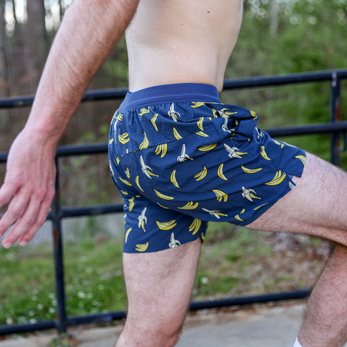 Man wearing the Avigate 5 inch Fusion Short in The Monkey Method print, close-up