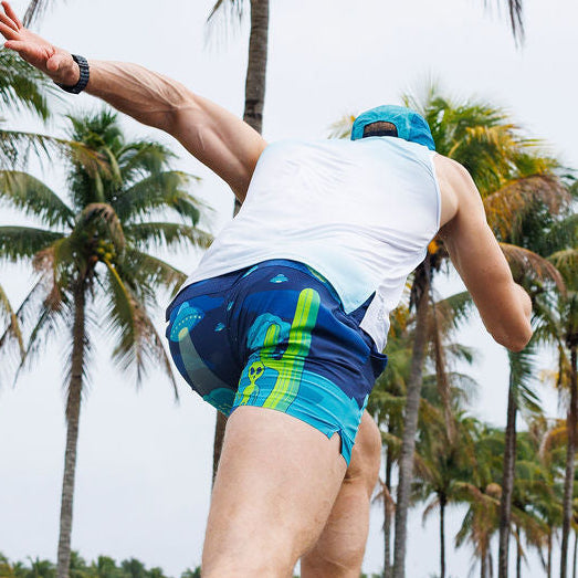 Man wearing the Avigate 5 inch Fusion Short in Uninvited Alien Antics print, side view