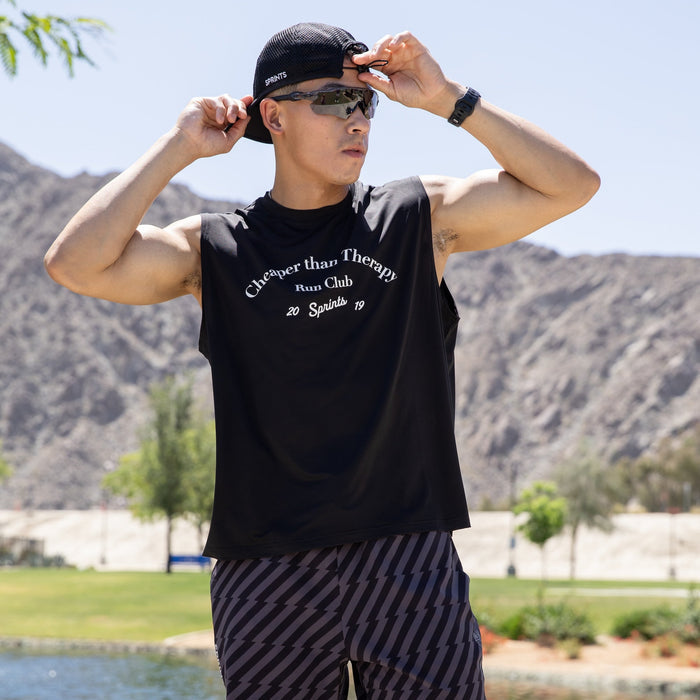Man wearing the Core Zero Framework Tank in Cheaper Than Therapy print