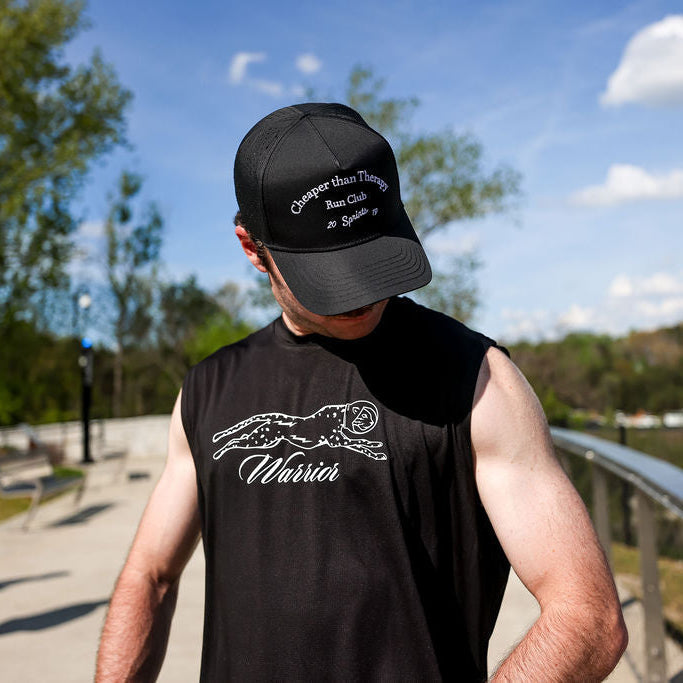 Man wearing the Core Zero Framework Tank in White Label, close-up