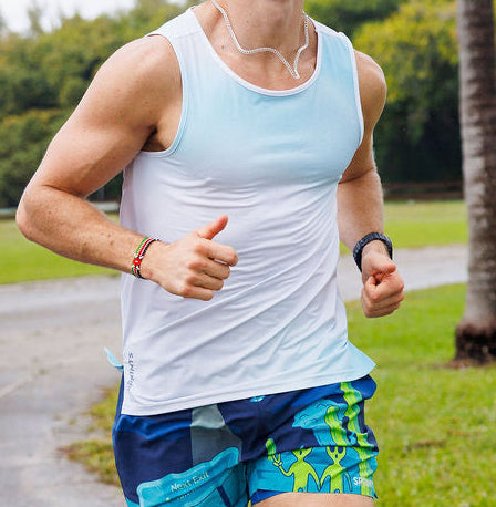 Man wearing the Core Zero Running Tank in Coastal Fade
