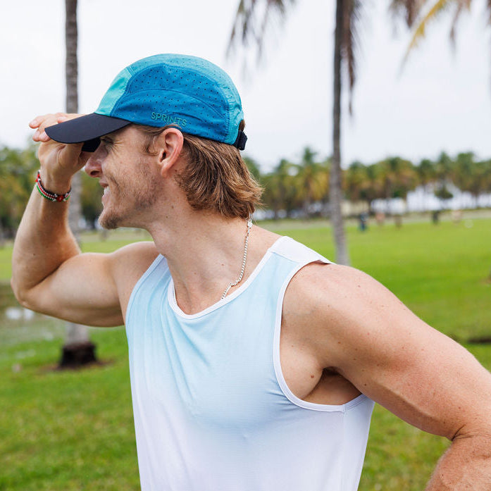 Man wearing the Core Zero Running Tank in Coastal Fade, side view