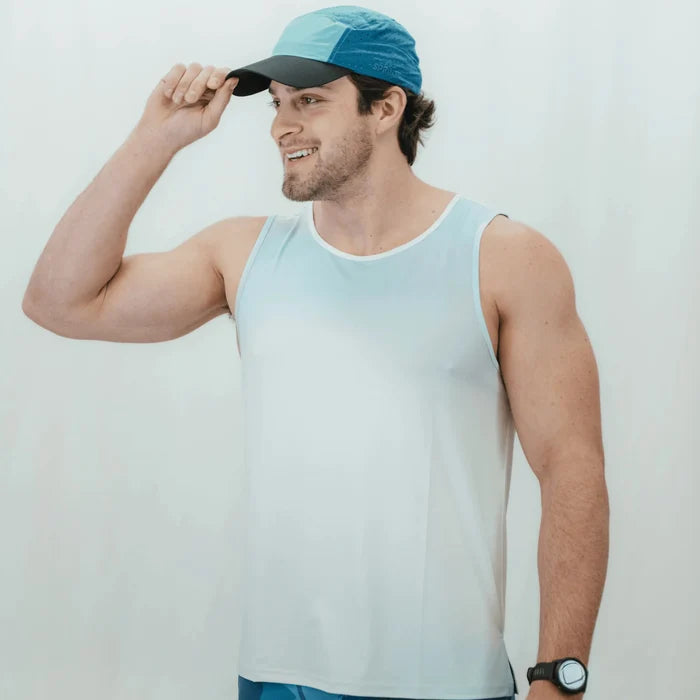 Man wearing the Core Zero Running Tank in Coastal Fade, close-up