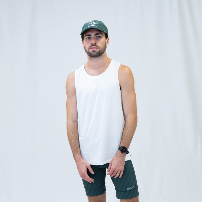Man wearing the Core Zero Running Tank in Stealth White, close-up