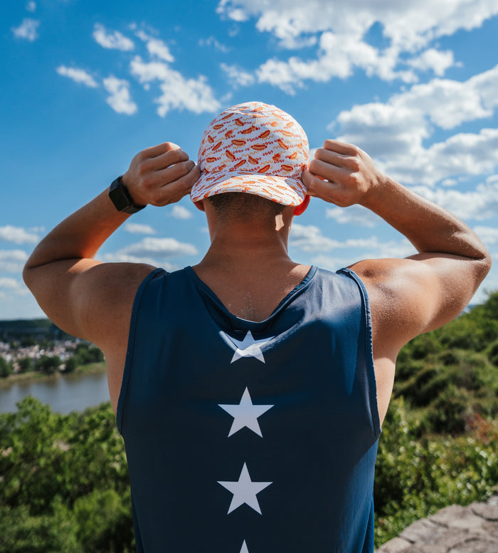 Man wearing the Mens Core Zero Running Tank, USA Navy