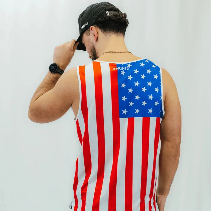 Man wearing the Core Zero Running Tank in USA White