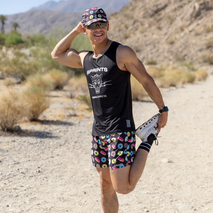 Man wearing the Core Zero Running Tank in Vault Jag Black, side view