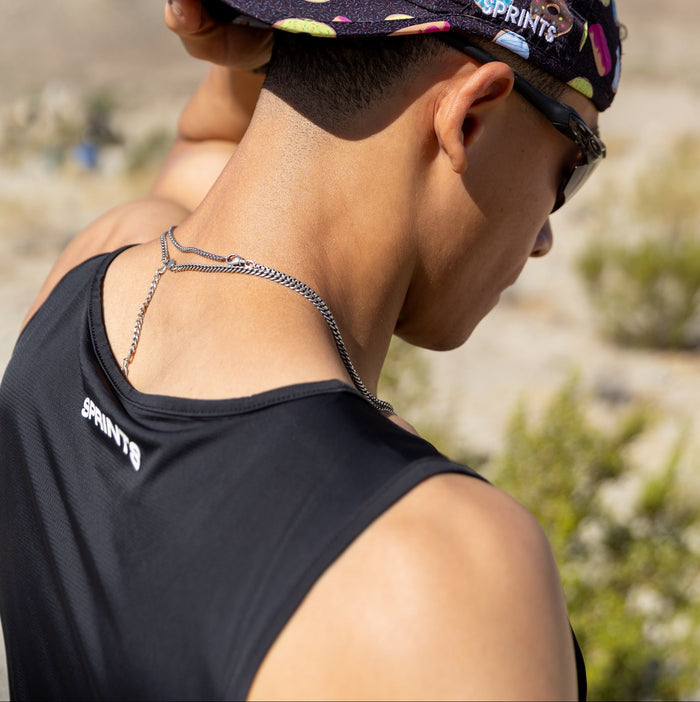 Man wearing the Core Zero Running Tank in Vault Jag Black, close-up