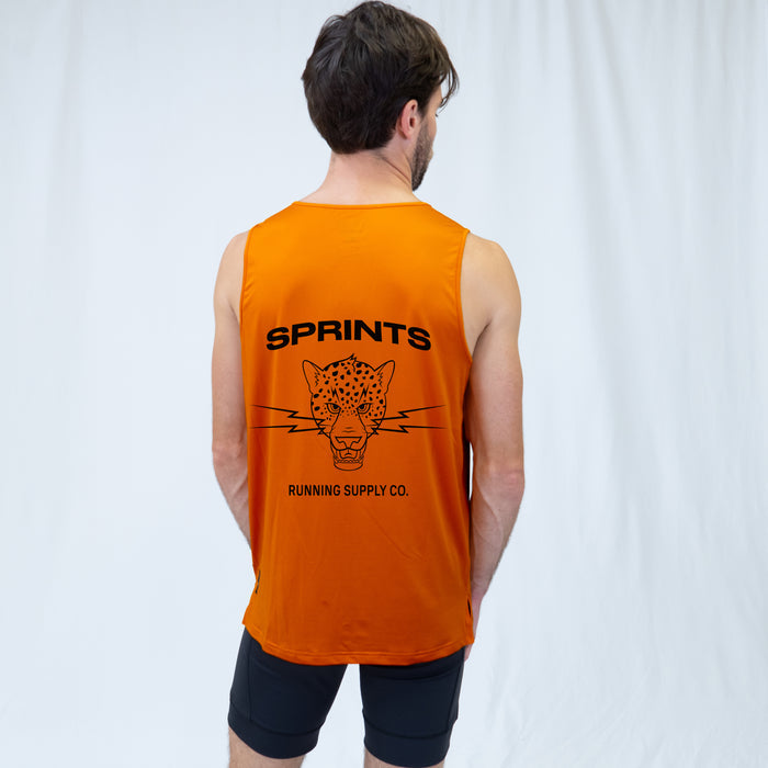Man wearing the Core Zero Running Tank in Vault Jag Orange